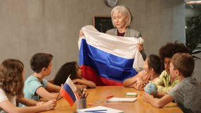 listening to teacher s story about Russia, child examines this country on globe. High quality FullHD footage - Powered by Shutterstock - Get 15% off with code: PIKWIZARD15