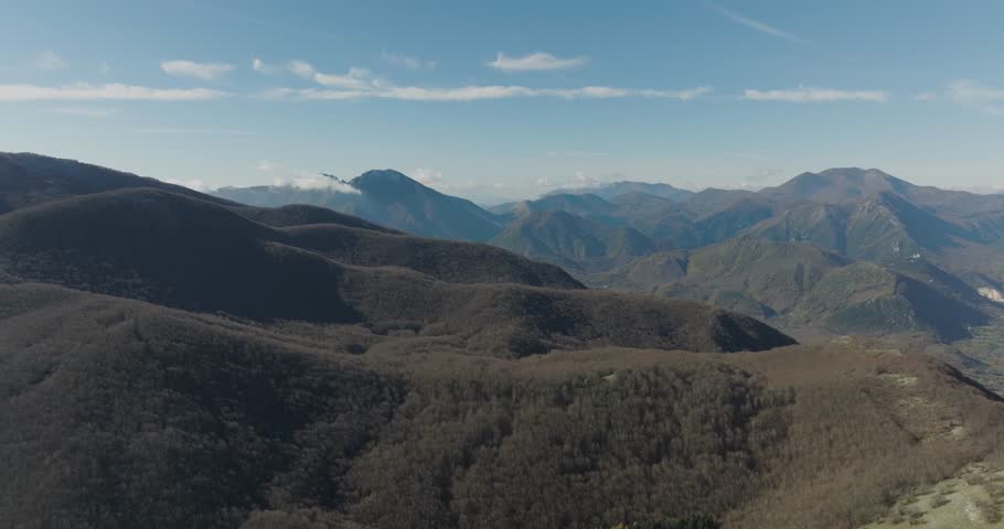 Aerial view of mountains covered with trees, Italy.