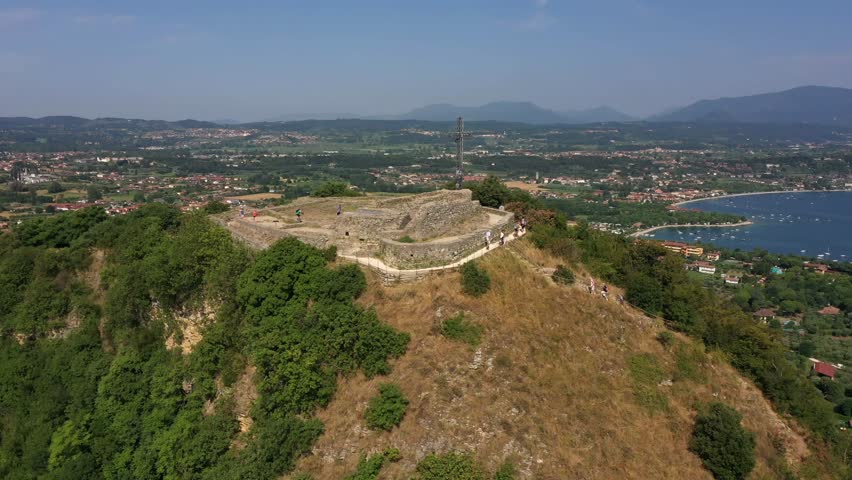Rocca di Manerba. Italian fortress, aerial footage. Sunny, multiple angles.