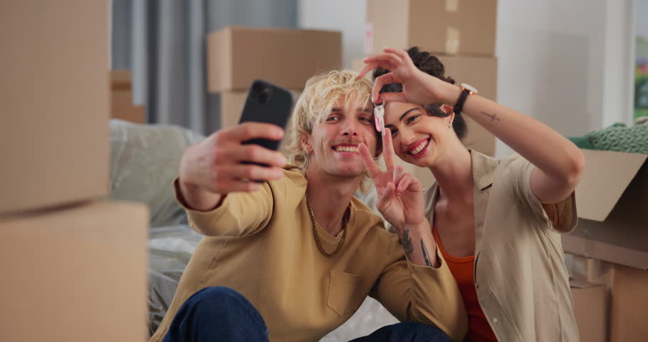 New home, selfie and couple with keys, smile and bonding together with peace sign. Rental apartment, man and woman with profile picture, excited and property investment with memory and real estate