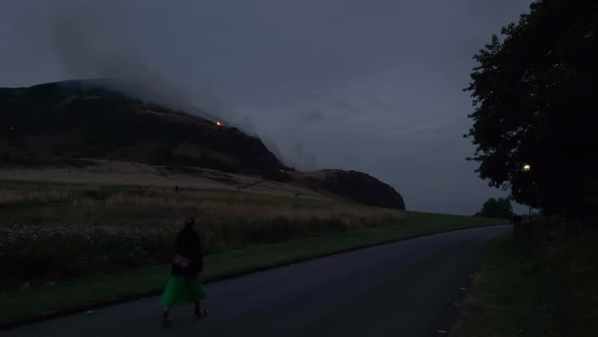 EDINBURGH, SCOTLAND, UK - AUGUST 10, 2025: A fire is visible on Arthur