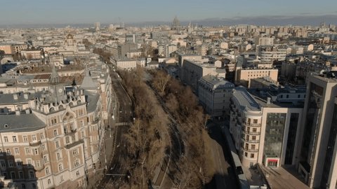 Smooth Descending Reverse Drone Shot over Urban