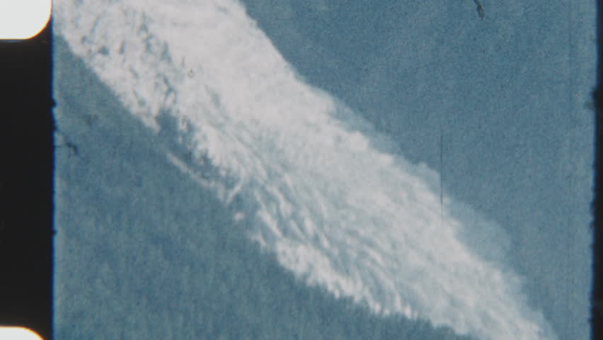 Vintage 8mm film captures the majestic beauty of Mont Blanc, its snow-covered peaks glowing under crisp blue skies