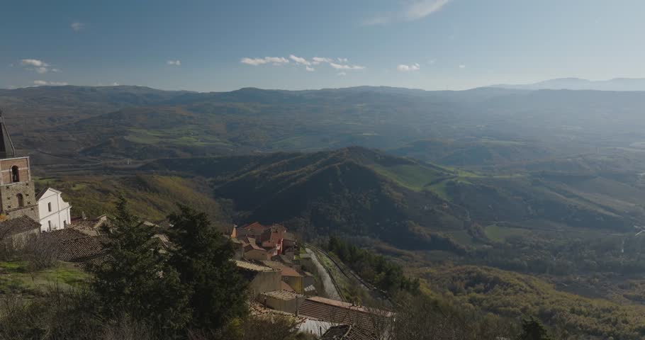Aerial view of buildings and mountains, Italy.