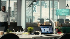 Business people greeting each other in office before a briefing meeting, colleagues discuss budgeting and project development. Diverse work team reviews reports and data on laptop. Camera B. - Powered by Shutterstock - Get 15% off with code: PIKWIZARD15