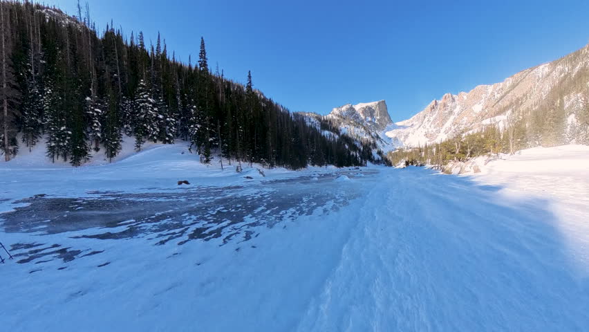 Wind Blows Snow Across Frozen Dream Lake in Rocky Mountain National Park
