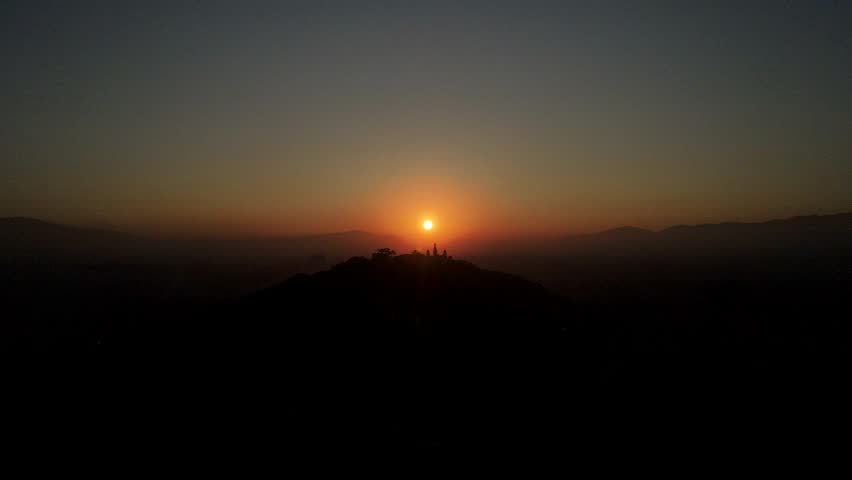 The aerial view shows a gloomy sunrise over the city of Kathmandu, Nepal.