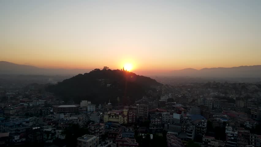The aerial view shows a gloomy sunrise over the city of Kathmandu, Nepal.