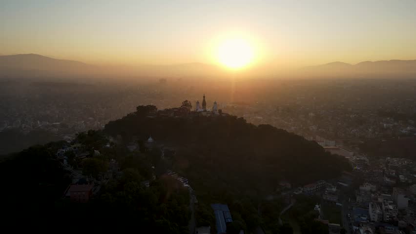 The aerial view shows a gloomy sunrise over the city of Kathmandu, Nepal.