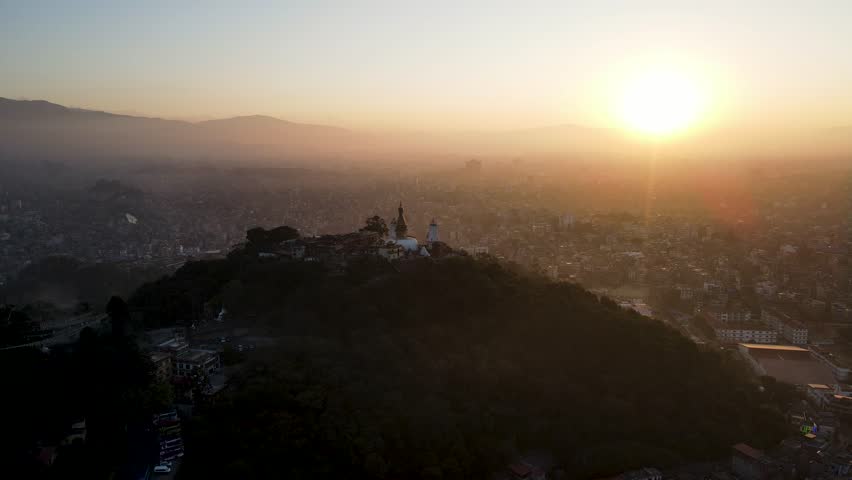 The aerial view shows a gloomy sunrise over the city of Kathmandu, Nepal.