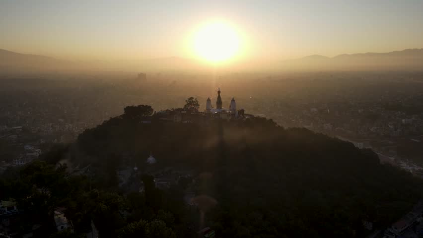 The aerial view shows a gloomy sunrise over the city of Kathmandu, Nepal.