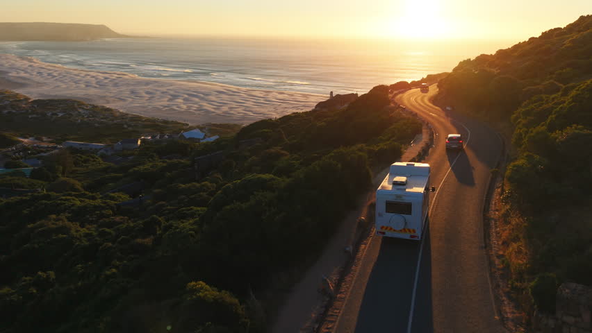 Travel, road trip and drone with van for adventure, transportation and summer vacation. Holiday destination, sunset view and motor vehicle driving in nature for journey, exploration and weekend