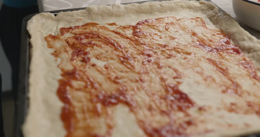 Man is Cooking Preparing Food Homemade Pizza on Kitchen. 4K 10-bit