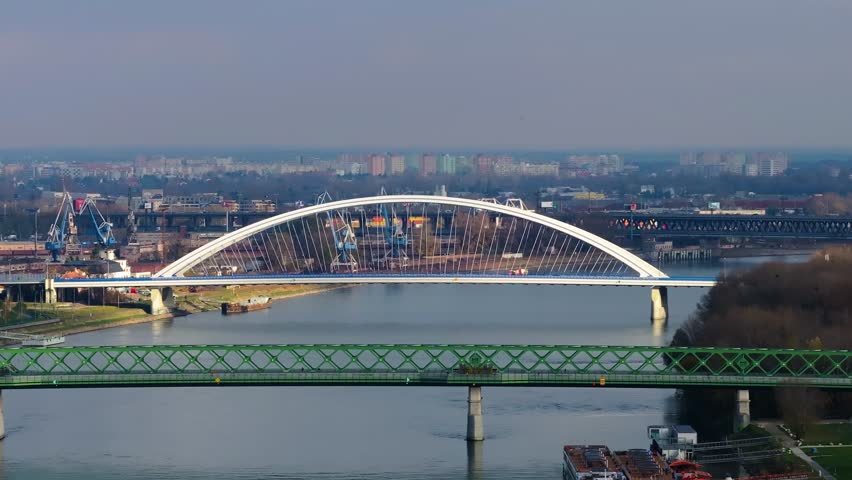 4K Aerial view of Bratislava city, showcasing the vibrant cityscape, historic old town, modern skyline, and the Danube River flowing through the capital. Slovakia_15