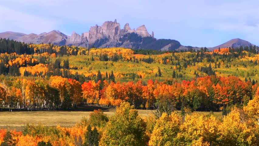 the Castle Mountain Mill Castle Gunnison National Forest Crested Butte Ohio Kebler Pass Colorado aerial drone parallax morning autumn fall Aspen tree colors blue sky ranch land farmland slide left
