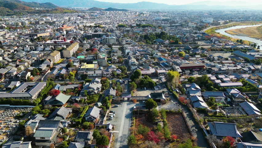 Aerial overvview of the Arashiyama cityscape, sunny, autumn day in Kyoto, Japan