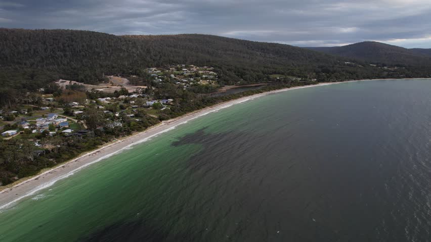 Panoramic View Of White Beach With Lush Green Mountains In Tasmania, Australia - Drone Shot