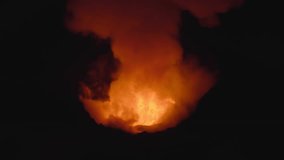 Majestic Eruption of a Fiery Volcano as Lava Bursts from the Crater, Illuminating the Night Sky with Vibrant Orange and Red Flames - Powered by Shutterstock - Get 15% off with code: PIKWIZARD15