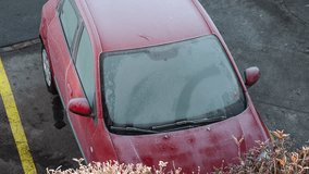 Time lapse video of melting morning frost on a car's windshield in the morning. Top down view, rising sun melting the snow frost, no people - Powered by Shutterstock - Get 15% off with code: PIKWIZARD15