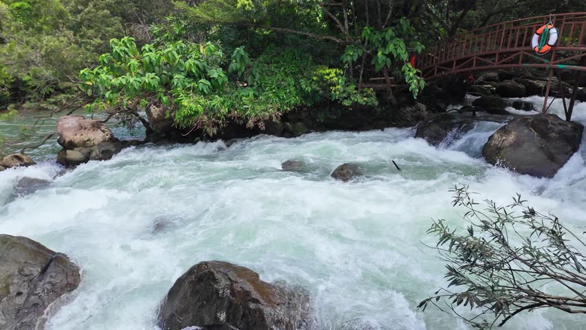 Superb view of summer: Slow motion of the fantastic Moot valley in Phong Nha National Park, Vietnam with the sound of a clear stream flowing through the peaceful tropical jungle