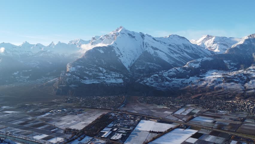 snow capped mountains in the south of switzerland, nice sunny weather