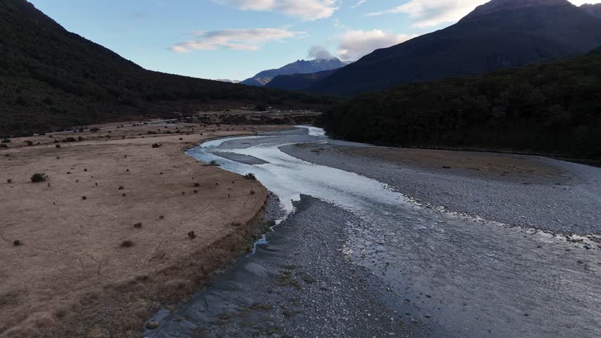 Drone flight over the river that flows through the Mount Aspiring Valley on New Zealand's South Island.