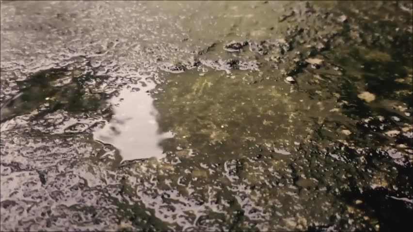 rain drops on concrete floor surface