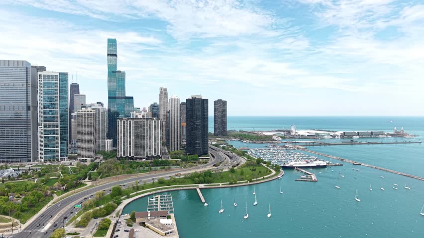 Drone Shot of Chicago USA, Navy Pier, Lake Shore Drive Traffic and Skyscrapers by Millennium Park