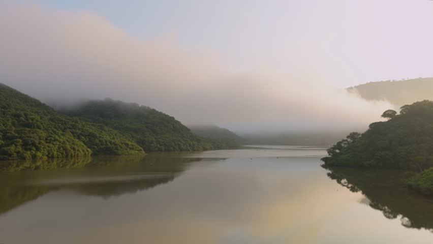 Misty Morning Over Calm Lake At El Carrizo Reservoir In Jalisco, Mexico. panning shot