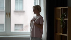 Attractive middle aged woman practicing mindfulness and deep breathing to reduce daily stress and pressure, doing self care rituals for mental health, relaxation practice and living stress free. - Powered by Shutterstock - Get 15% off with code: PIKWIZARD15