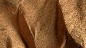 Macro shot of natural textured brown kraft paper surface for holiday wrapping, rustic background, eco style, festive decor, creative design, perfect stock image for Christmas, celebration, and craft. - Powered by Shutterstock - Get 15% off with code: PIKWIZARD15