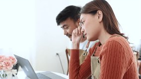 Young coffee shop owner feeling stressed while working on early business results, inexperienced entrepreneurs facing financial difficulty, lack learning, emotional pressure in small business startup - Powered by Shutterstock - Get 15% off with code: PIKWIZARD15