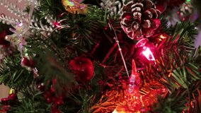 Close up of a decorated Christmas tree branch with gold ornaments, pine cones, and fresh snow creating a festive winter holiday mood. - Powered by Shutterstock - Get 15% off with code: PIKWIZARD15