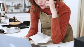 Young coffee shop owner feeling stressed while working on early business results, inexperienced entrepreneurs facing financial difficulty, lack learning, emotional pressure in small business startup - Powered by Shutterstock - Get 15% off with code: PIKWIZARD15