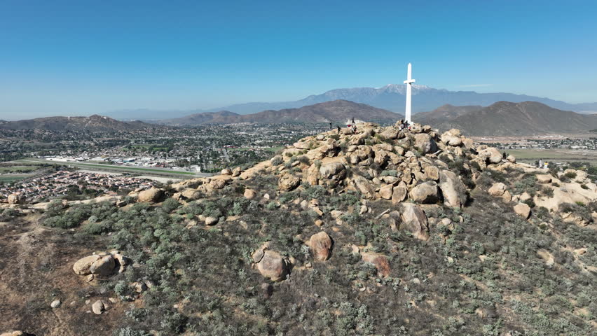 Riverside, California – Drone View of Mount Rubidoux Summit with Hikers, Cross, and Stone Tower on a Sunny Day in Downtown Riverside, CA