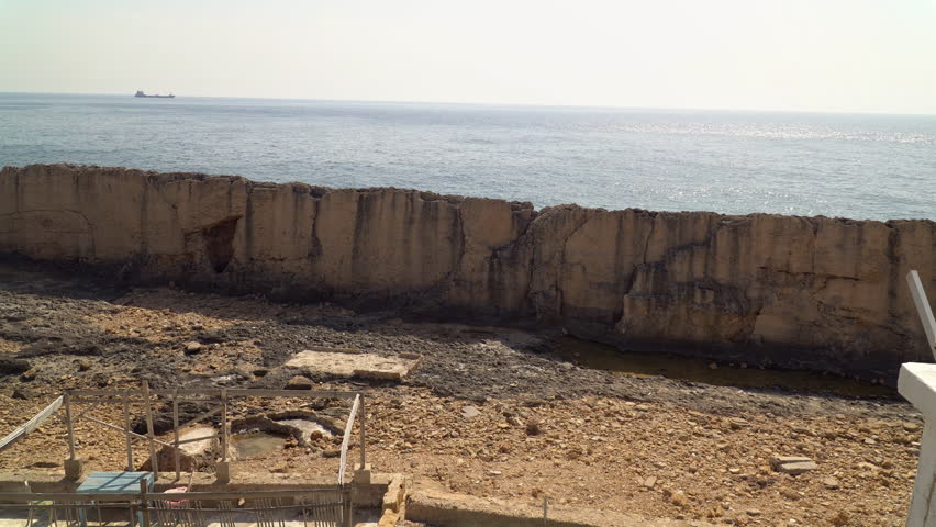 Picturesque view of the Phoenician wall, an ancient stone wall located on the Mediterranean coast in Batroun, northern Lebanon.