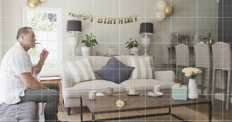 Seated man watching grid sparking red graph sweeping over room while pair embracing for event promo. Birthday, home, celebration, livingroom, balloons, banner, cake