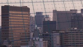 On play neon green graph entering left, climbing, dipping, spiking to show market trends. Cityscape, skyline, grid, dataviz, overlay, urban, dusk - Powered by Shutterstock - Get 15% off with code: PIKWIZARD15