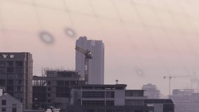 Text fading starting sequence, graphics sliding, pie growing over tower, showing construction data. Cityscape, crane, scaffolding, teal, infographic, dashboard, analytics - Powered by Shutterstock - Get 15% off with code: PIKWIZARD15