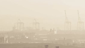 On data tick blue info cluster fading dropping scaling and settling over hazy port tracking cargo. Infographics, industrial, cranes, warehouses, skyline, globes, charts - Powered by Shutterstock - Get 15% off with code: PIKWIZARD15