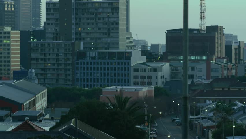 Blue streaks starting at left edge sweeping across skyline, overlaying buildings, showing data flow. Cityscape, harbor, urban, modern, grid, digital, futuristic - Powered by Shutterstock - Get 15% off with code: PIKWIZARD15