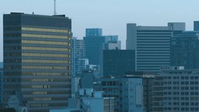 Faint world map fading in, data nodes and hex grid spreading over urban skyline, visualizing data. Cityscape, aerial, downtown, rooftop, overlay, infographic, network - Powered by Shutterstock - Get 15% off with code: PIKWIZARD15