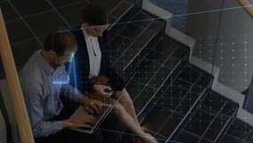 Business colleagues collaborating as man opening laptop and typing, waveform overlaying screen. Staircase, interior, holographic, gridlines, visualization, teamwork, dialogue - Powered by Shutterstock - Get 15% off with code: PIKWIZARD15