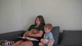 relaxed afternoon with family and playful toys, mom peacefully reading with children and colorful playthings, calm family moment featuring mother reading to toddlers amidst toys and newborn - Powered by Shutterstock - Get 15% off with code: PIKWIZARD15