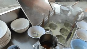 This video shows the process of making wonton noodles, focusing on the seasoning and noodle-boiling stations. Non-halal. the process of boiling noodles. - Powered by Shutterstock - Get 15% off with code: PIKWIZARD15