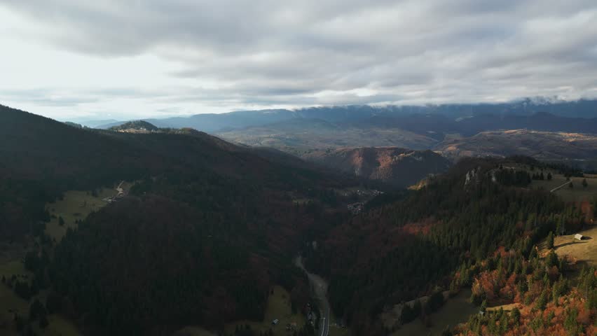 Cloudscape Over Carpathian Mountains During Autumn In Moieciu de Sus, Romania. Aerial Drone Shot