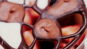 Elegant dessert in a glass topped with fresh strawberries, blueberries, and a chocolate lattice decoration - Powered by Shutterstock - Get 15% off with code: PIKWIZARD15