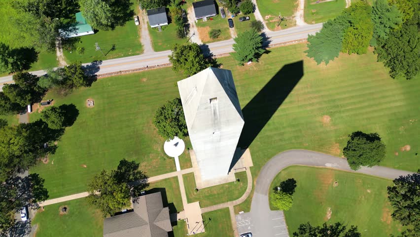 Aerial overhead orbit of the Jefferson Davis Monument located in Fairview, Kentucky