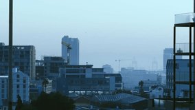 Urban skyline receiving data pulse, floating icons forming linked hex grids, visualizing network. Cityscape, metropolis, highrise, cranes, balcony, palm, hazy - Powered by Shutterstock - Get 15% off with code: PIKWIZARD15