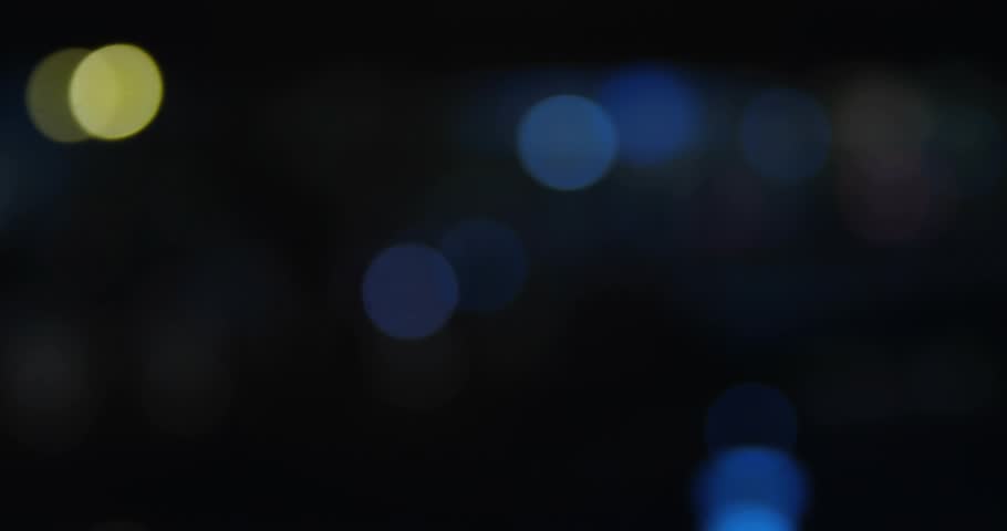 Small cluster popping lower left bubbles growing drifting center then exiting right to show surge. Notifications, icons, counters, urban, night, bokeh, glow